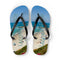 Laguna Beach flip-flops with ocean waves and beachgoers.