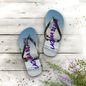 Flip-flops with "LAGUNA BEACH" text and ocean sunset scene.