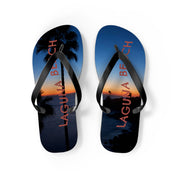 Flip-flops with "Laguna Beach" text and palm trees at sunset.