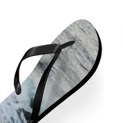 Black flip-flop with marbled grey and white sole.