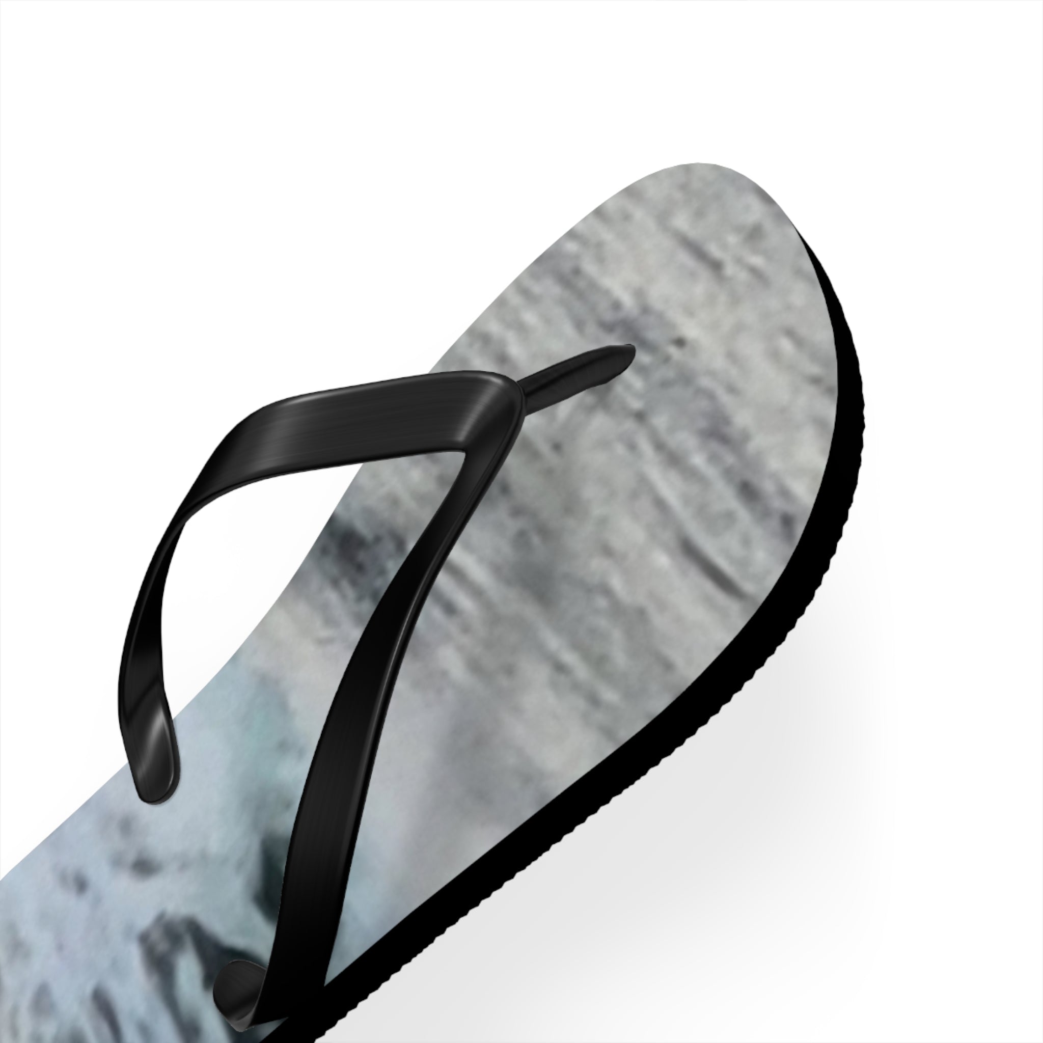 Black flip-flop with marbled grey and white sole.