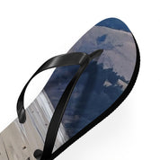 Flip-flops with a beach and ocean landscape design.