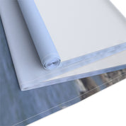 Rolled fabric in light blue and white with visible stitching.