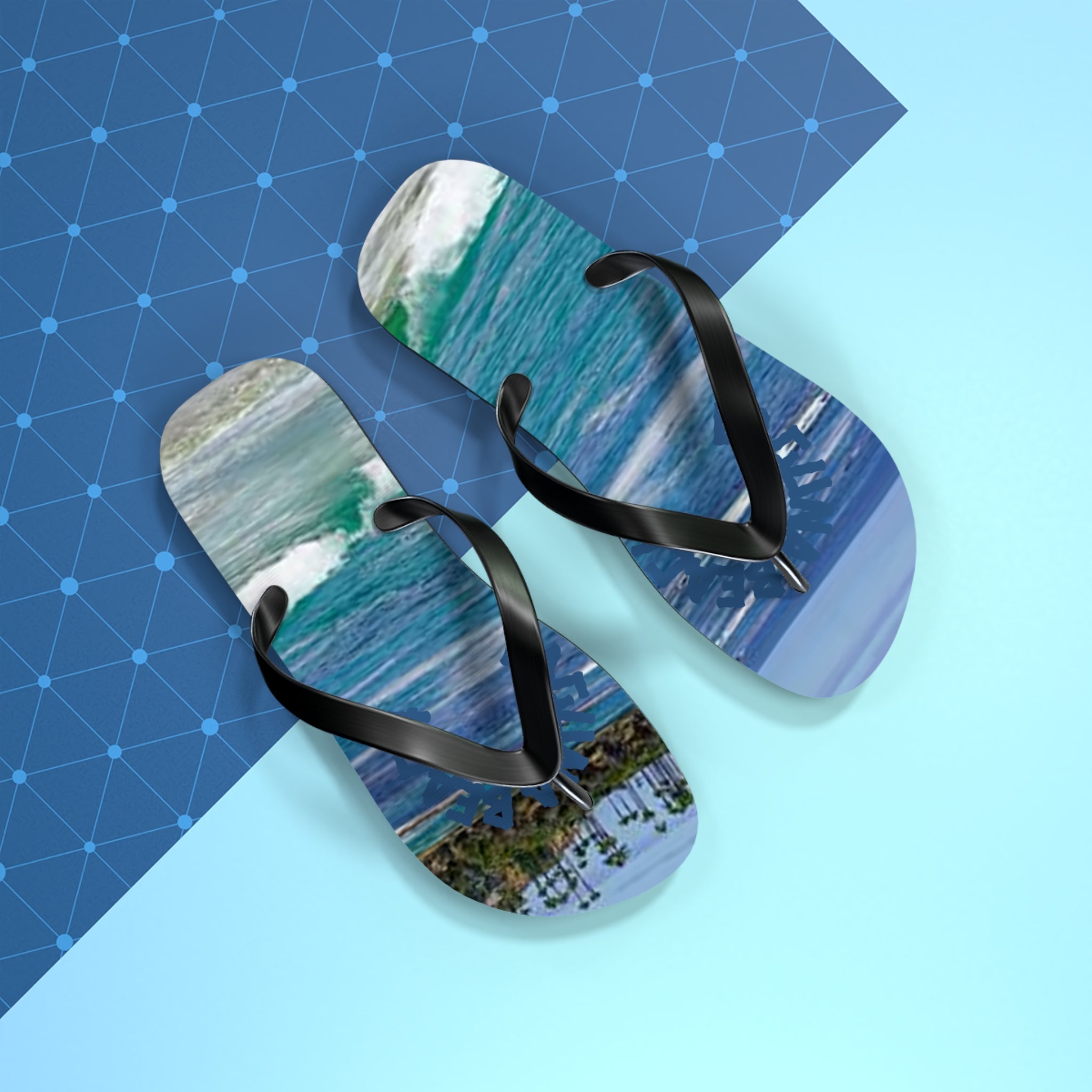 Flip-flops with ocean waves and palm trees on a blue and white background.