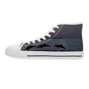 High-top sneakers featuring leaping dolphins against a sunset ocean scene.
