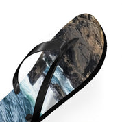 Flip-flops with a dynamic ocean and rocky shore scene print.