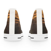 Back view of two white high-top sneakers with a sunset cloud print.