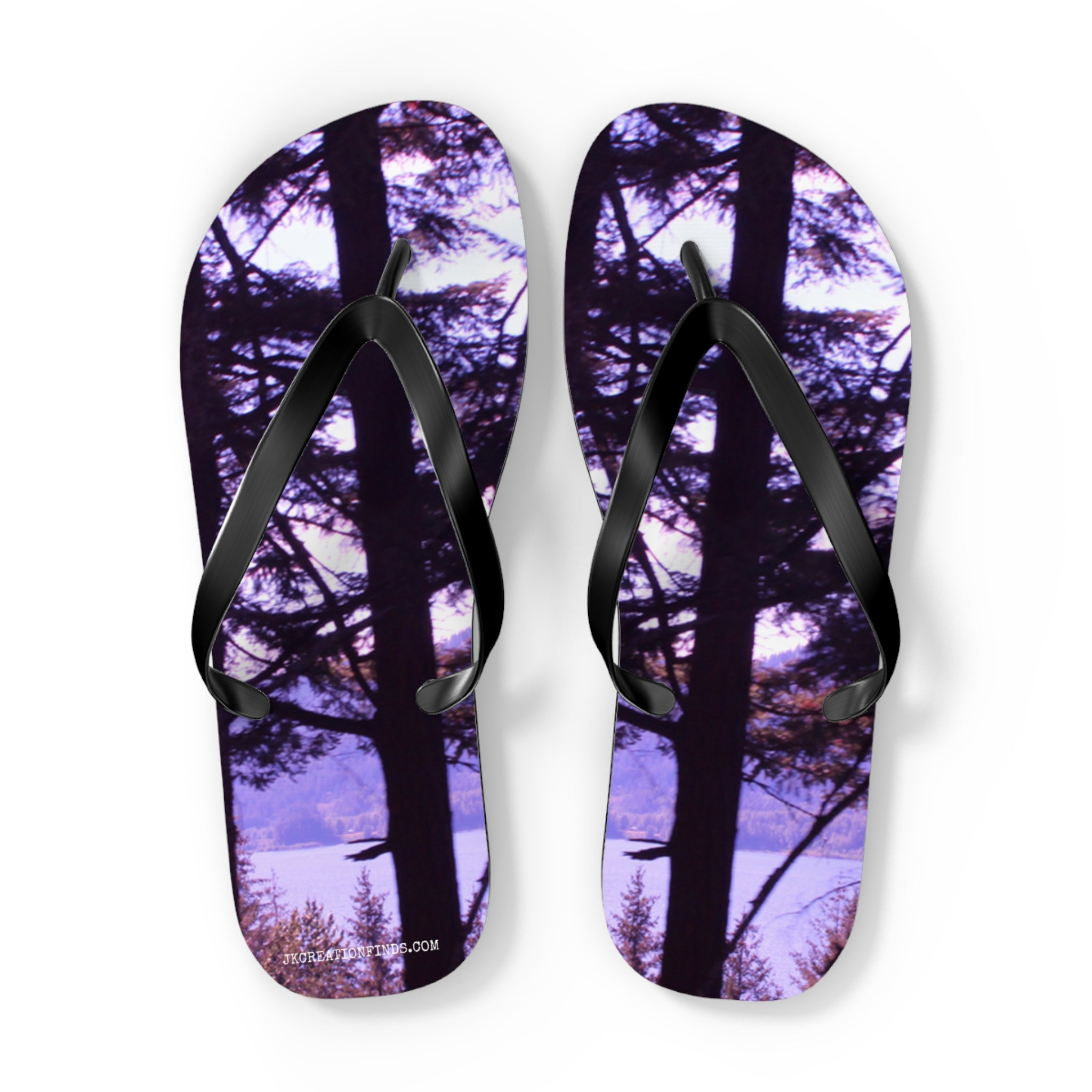 Flip-flops with a forest and lake scene on the soles.