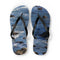 Flip-flops with a rocky ocean wave pattern on white background.