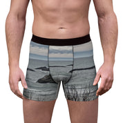 Men's boxer briefs with a rocky ocean landscape print.