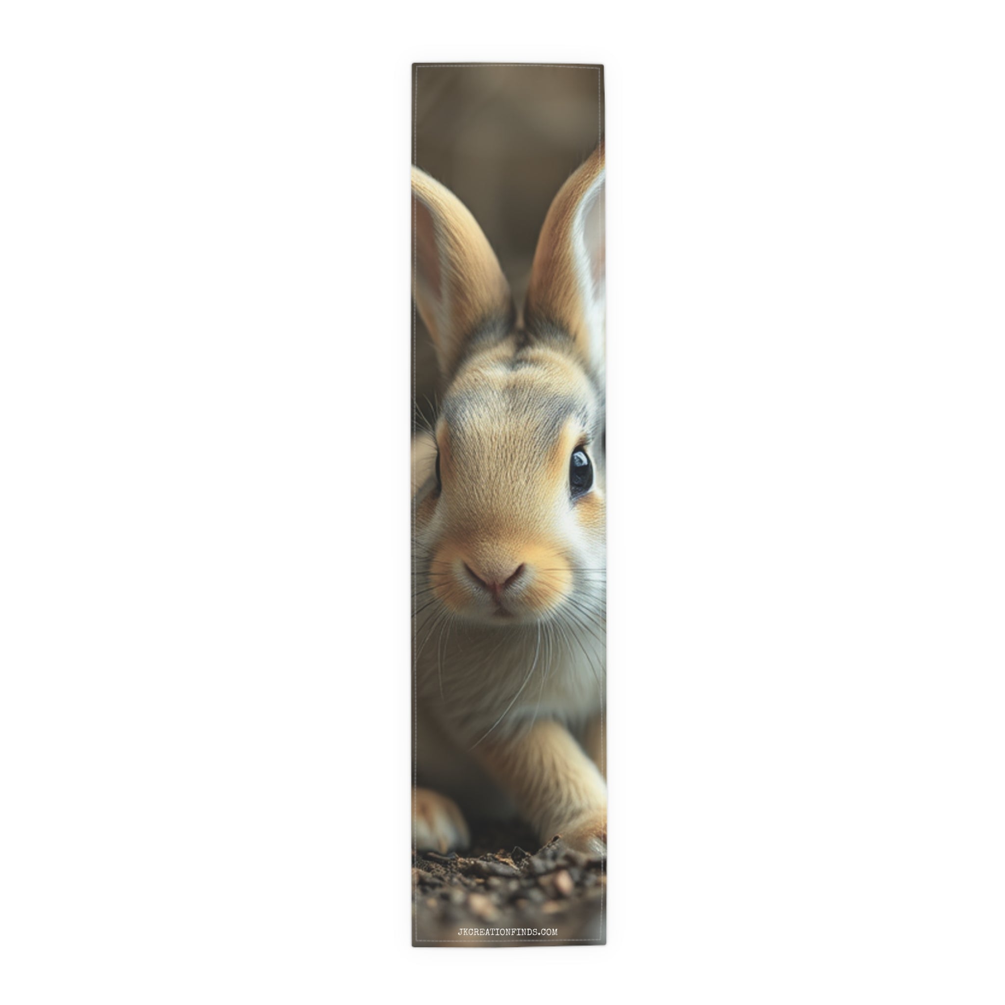 Close-up of a brown rabbit with large ears, centered vertically.