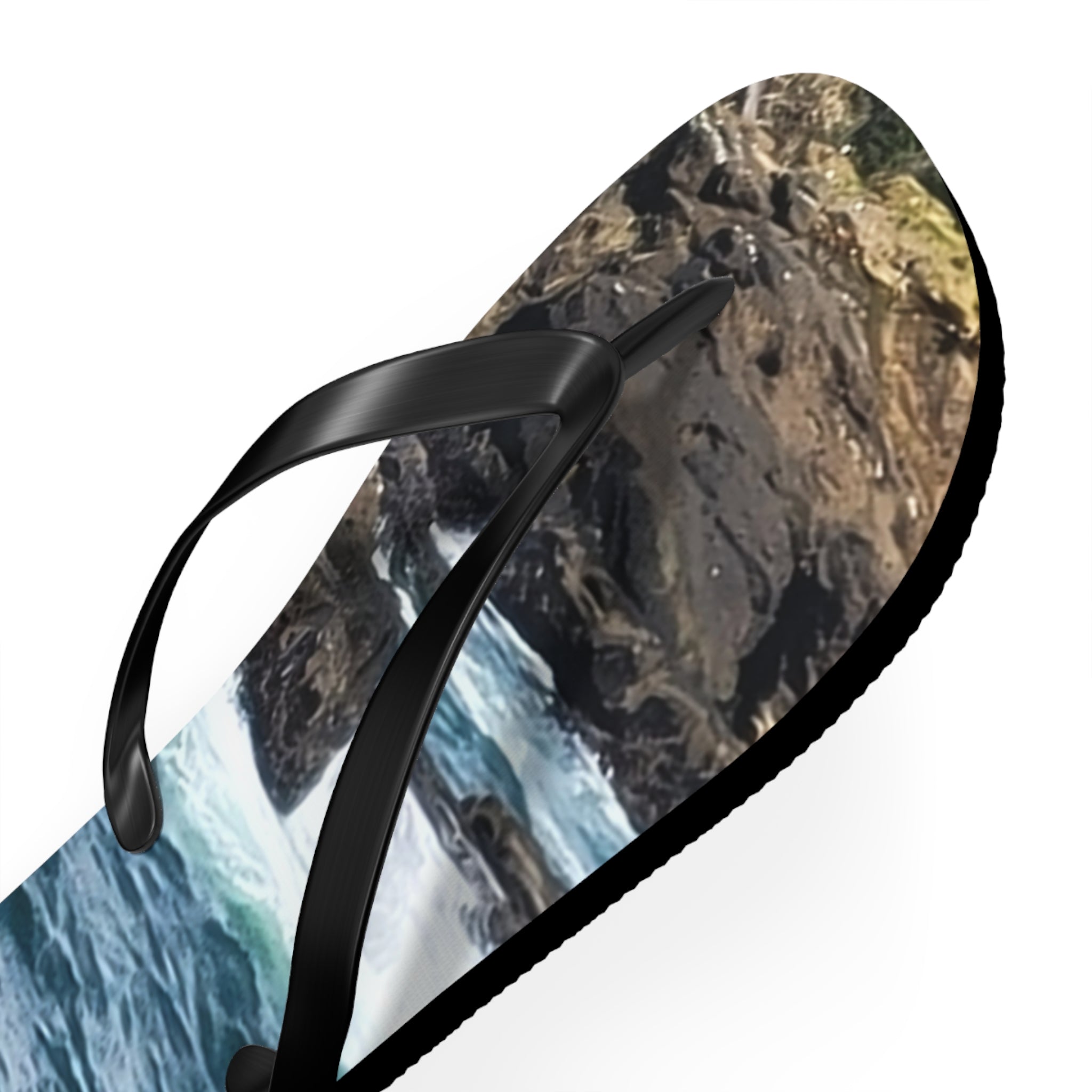 Flip-flops with a rocky coast and ocean wave graphic.