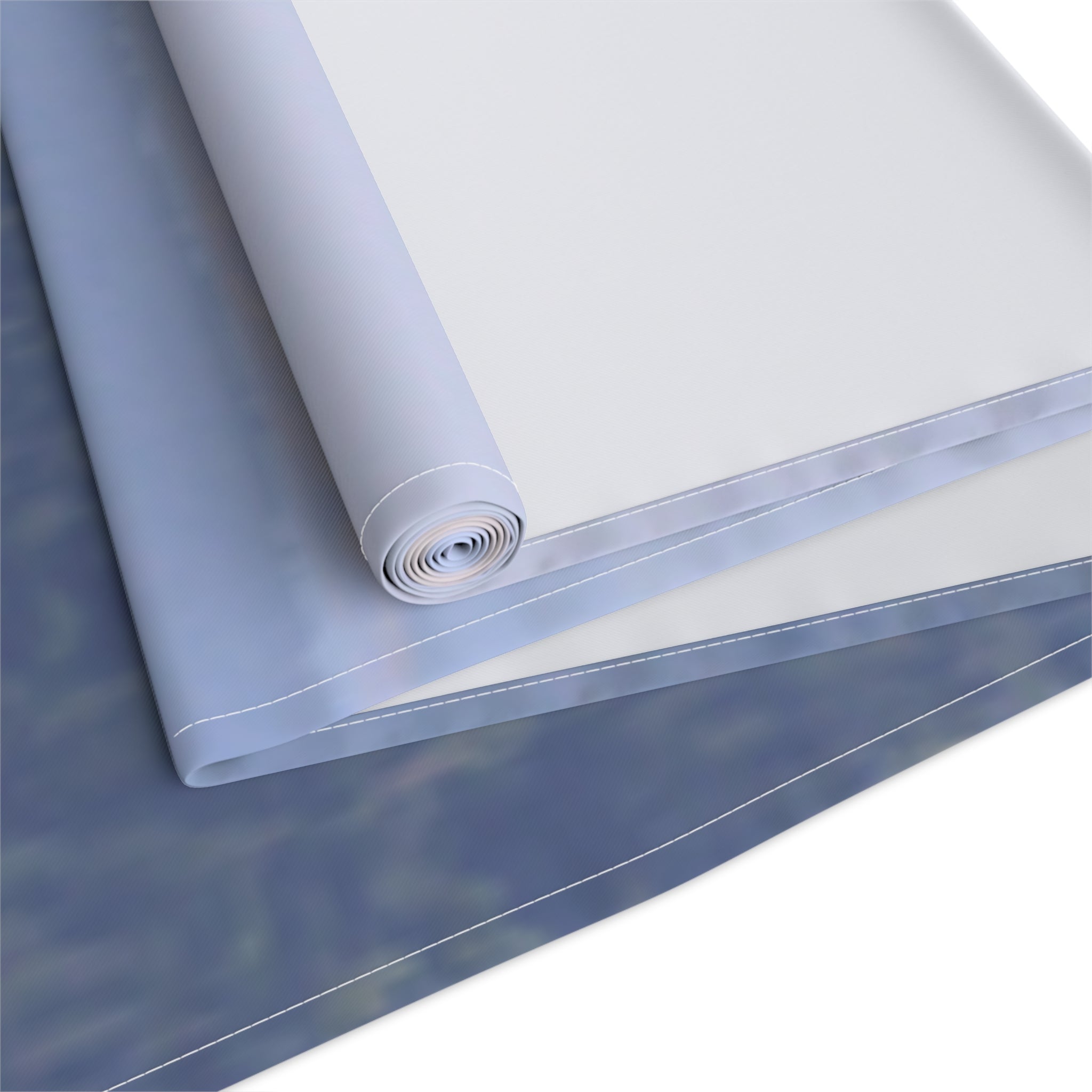 Rolled fabric with white stitching against a white background.