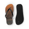 Flip-flops with a sunset beach scene and textured black sole.