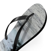 Black flip-flop with a grey and white textured sole.