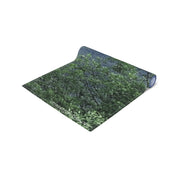 Rolled yoga mat with green foliage pattern and "JKCREATIONFINDS.COM" text.
