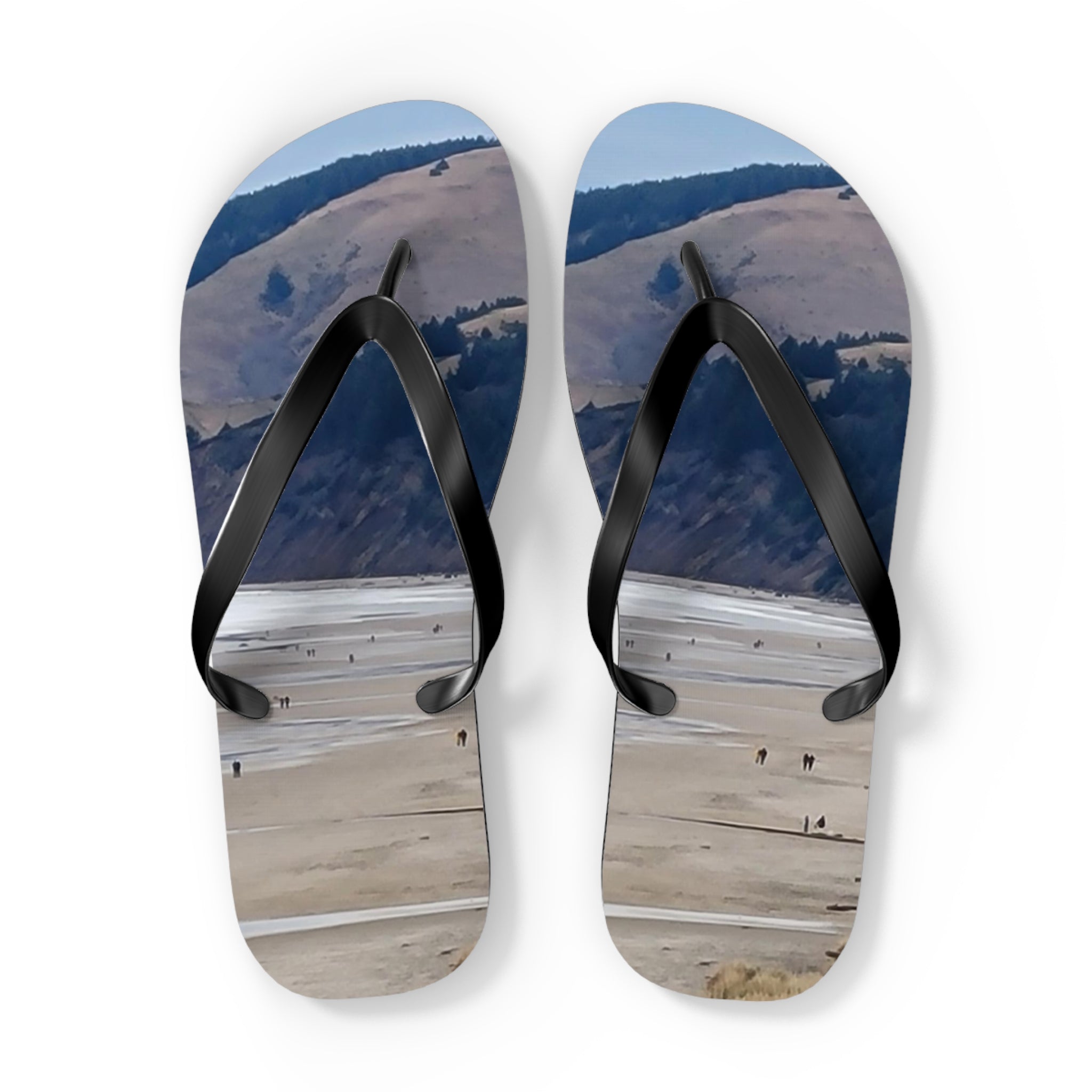 Flip-flops with a landscape scene featuring a body of water and distant hills.
