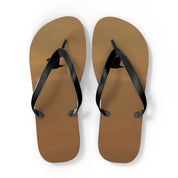 Brown flip-flops with a black silhouette of a bird on each sole.